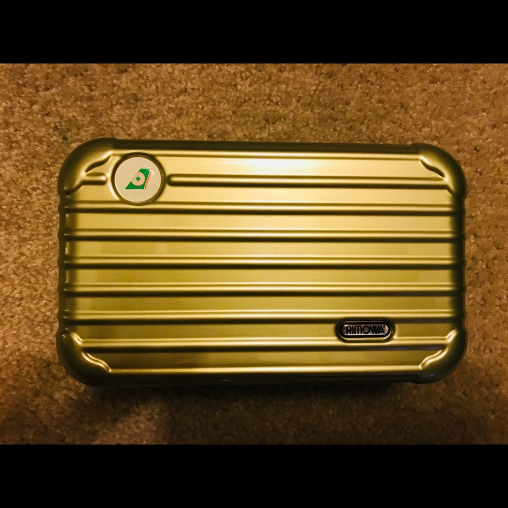 Rimowa travel bag. Eva air metallic light green